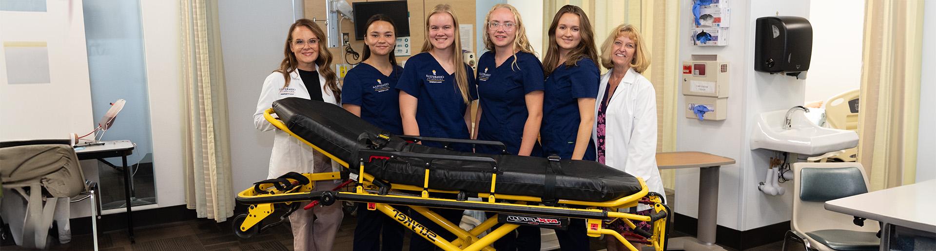 护理 faculty and students with new Stryker stretcher 1920